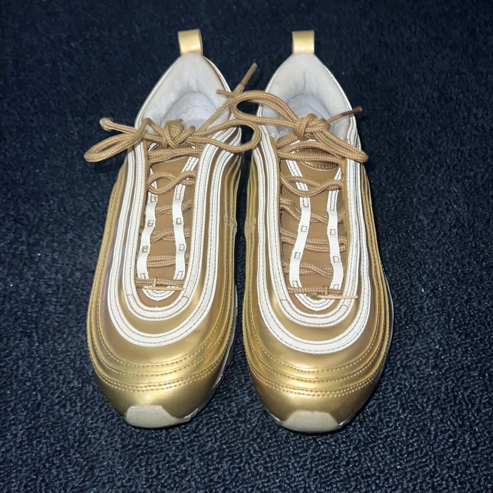 gold nike shoes